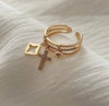 Cross charm ring